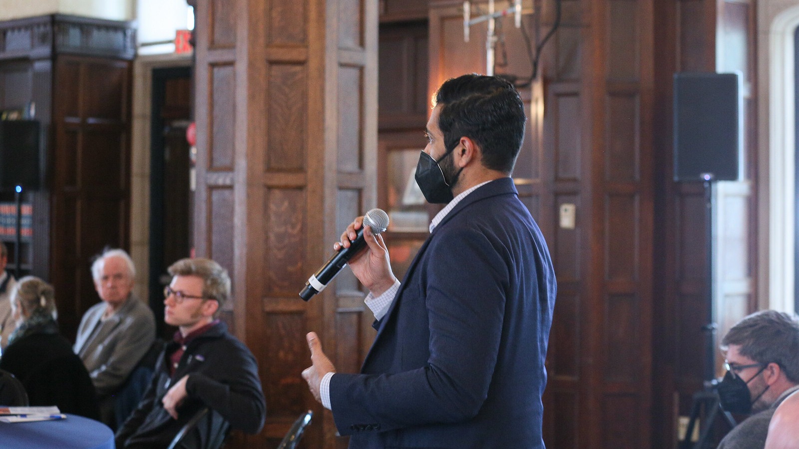 A Georgetown University student asks the panelists a question.