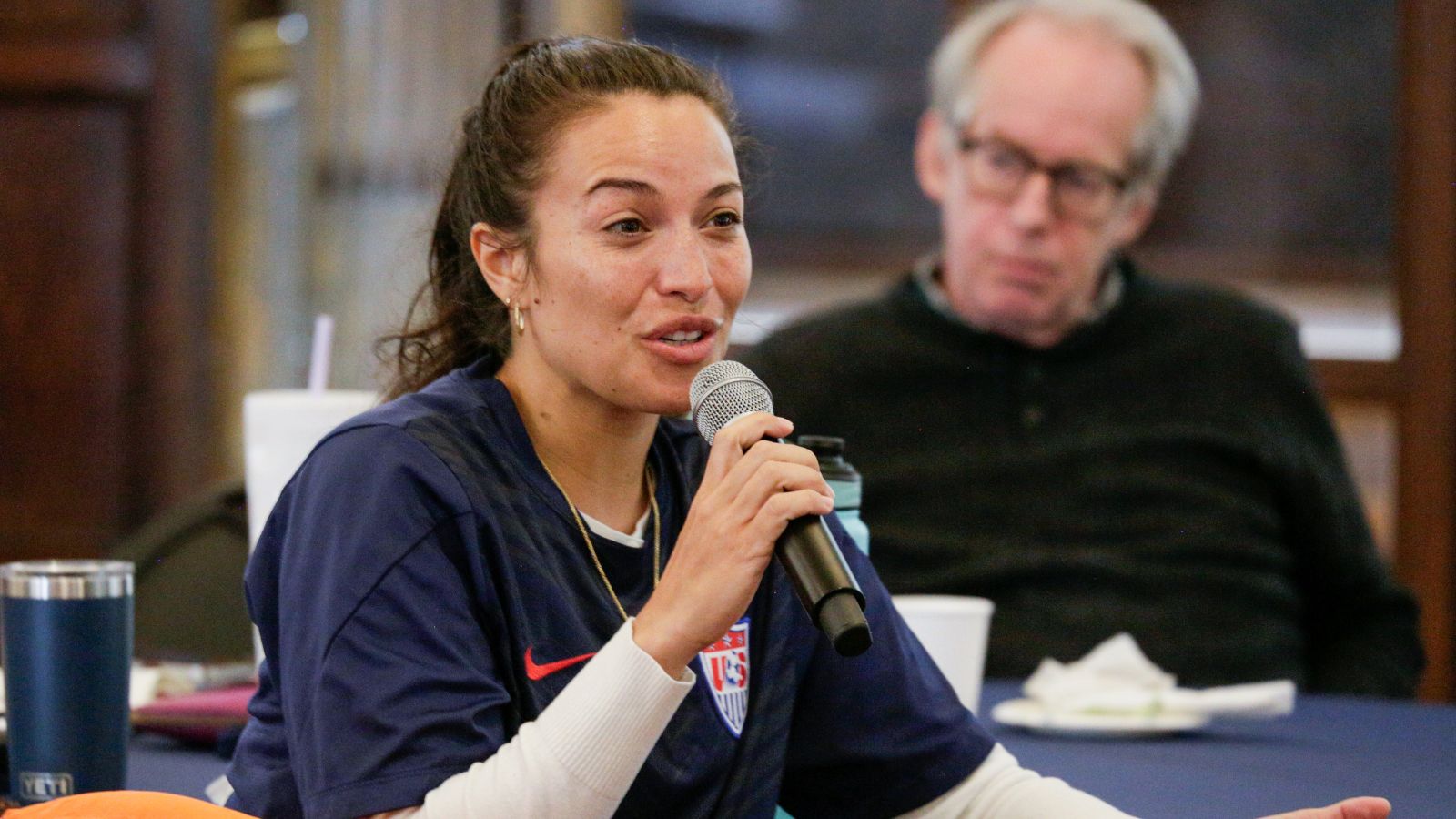 Audience member asks a question to the speaker.