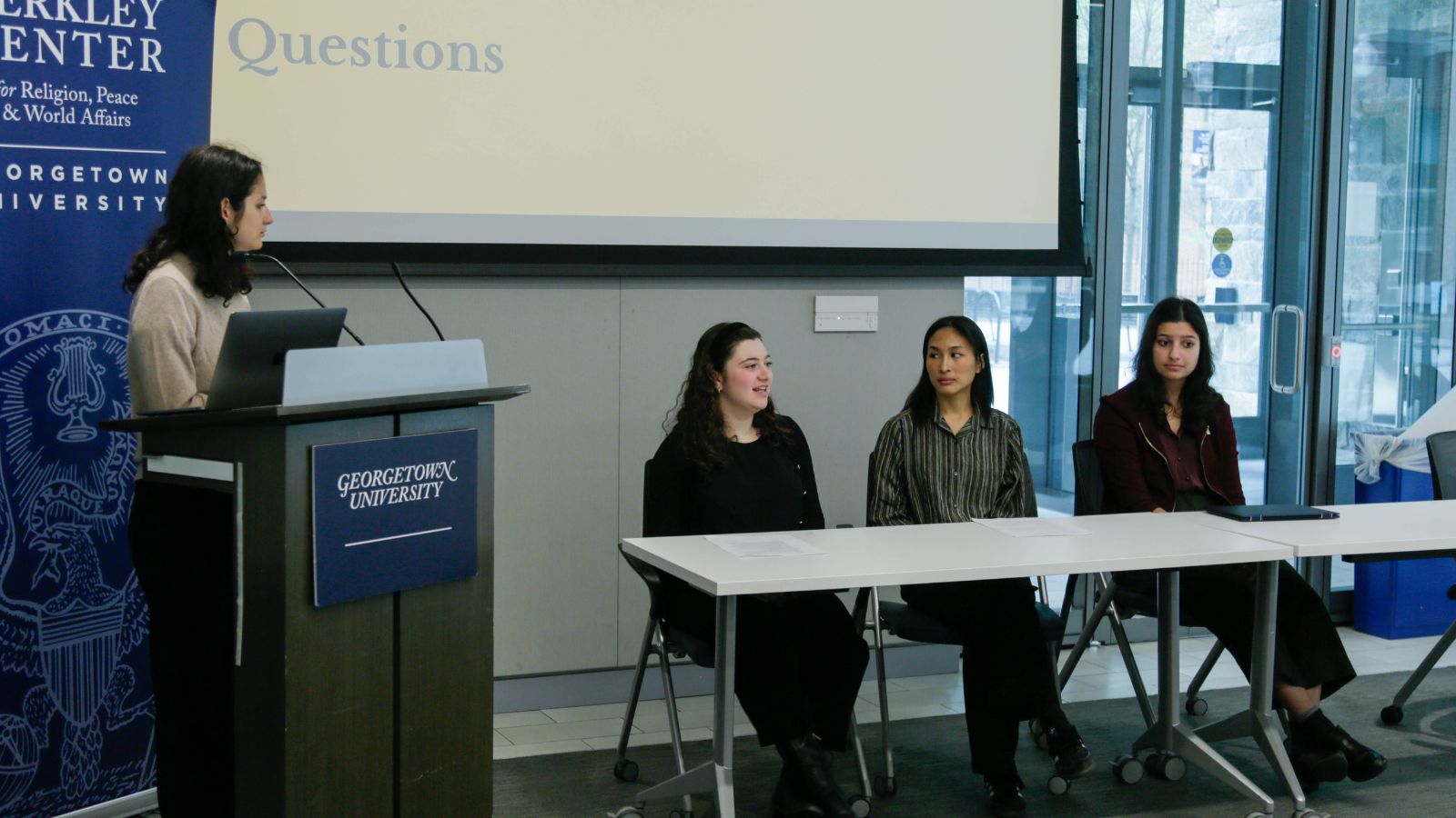 Students on the "Religion and Ethics" panel answering audience questions.