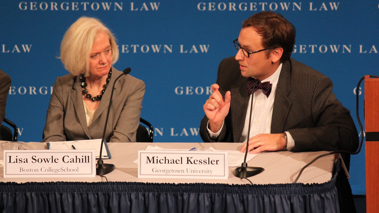 Lisa Cahill and Michael Kessler speak on a panel at the event.