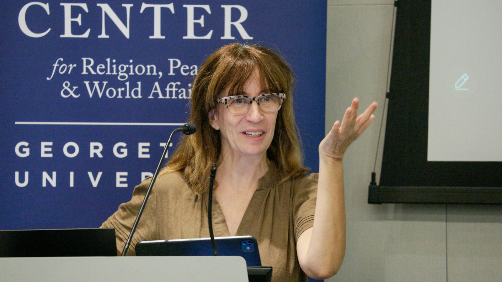 Maria Moreno, Assistant Professor in the Department of Spanish and Portuguese, facilitates the first panel.