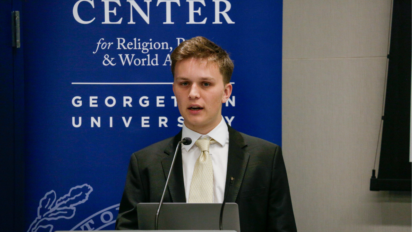 Elias Laurent (G'27), the REWA capstone class teaching assistant, introduces the panels