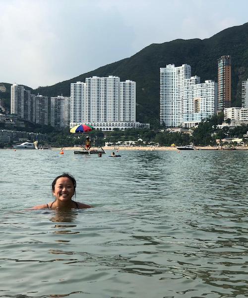 Photo features the author at Middle Bay Beach in Hong Kong, one of many beaches on the East Side of the city.