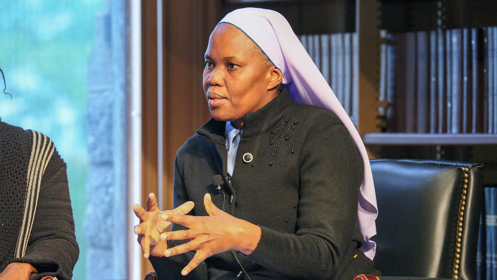 Sister Hedwig Muse, LSMIG, speaking at an event