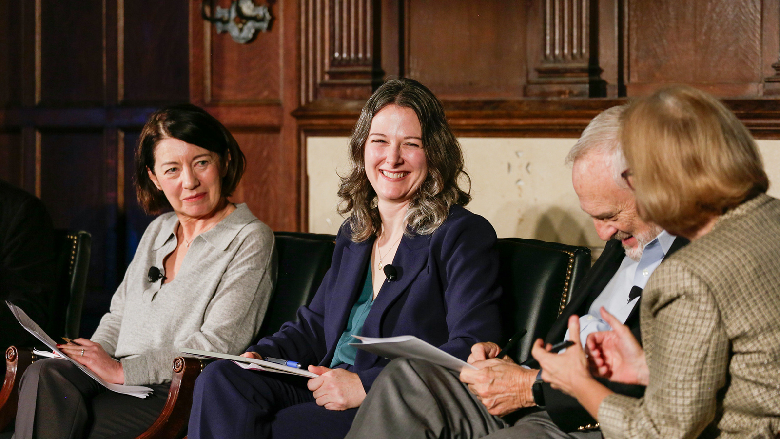 Erin Cline smiles while talking with other panelists