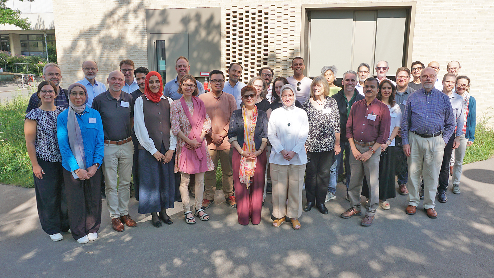 Group photo of 2025 Building Bridges Seminar participants standing in front of the Center for Islamic Theology