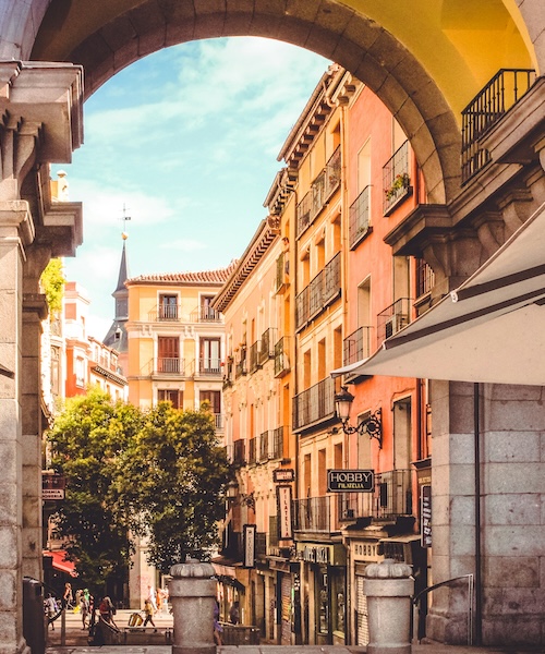 An archway to a street in Madrid