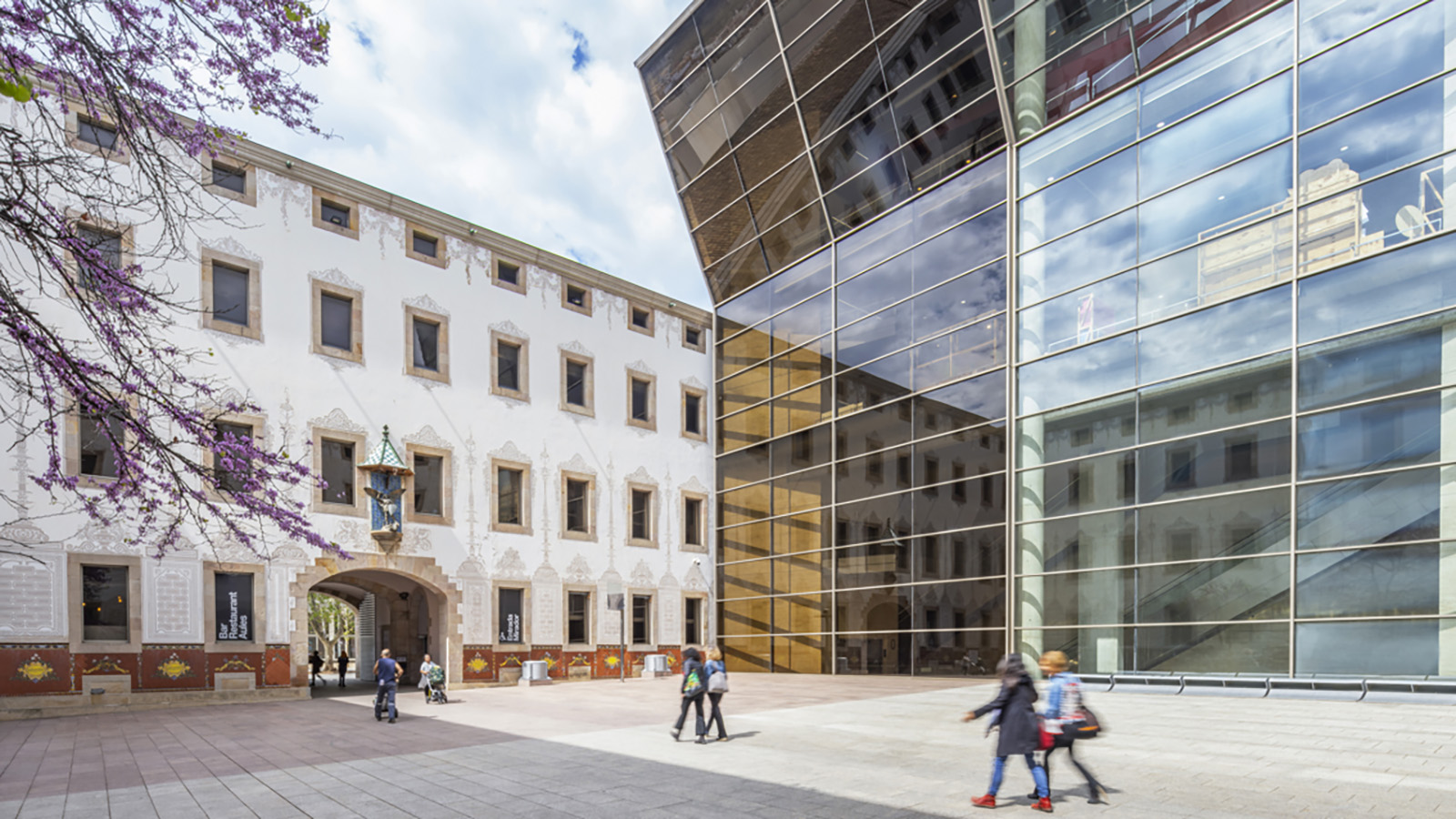 Exterior shot of the Centre de Cultura Contemporània de Barcelona, with people walking