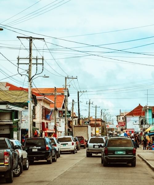 Cars driving on a busy road in Belize City, Belize