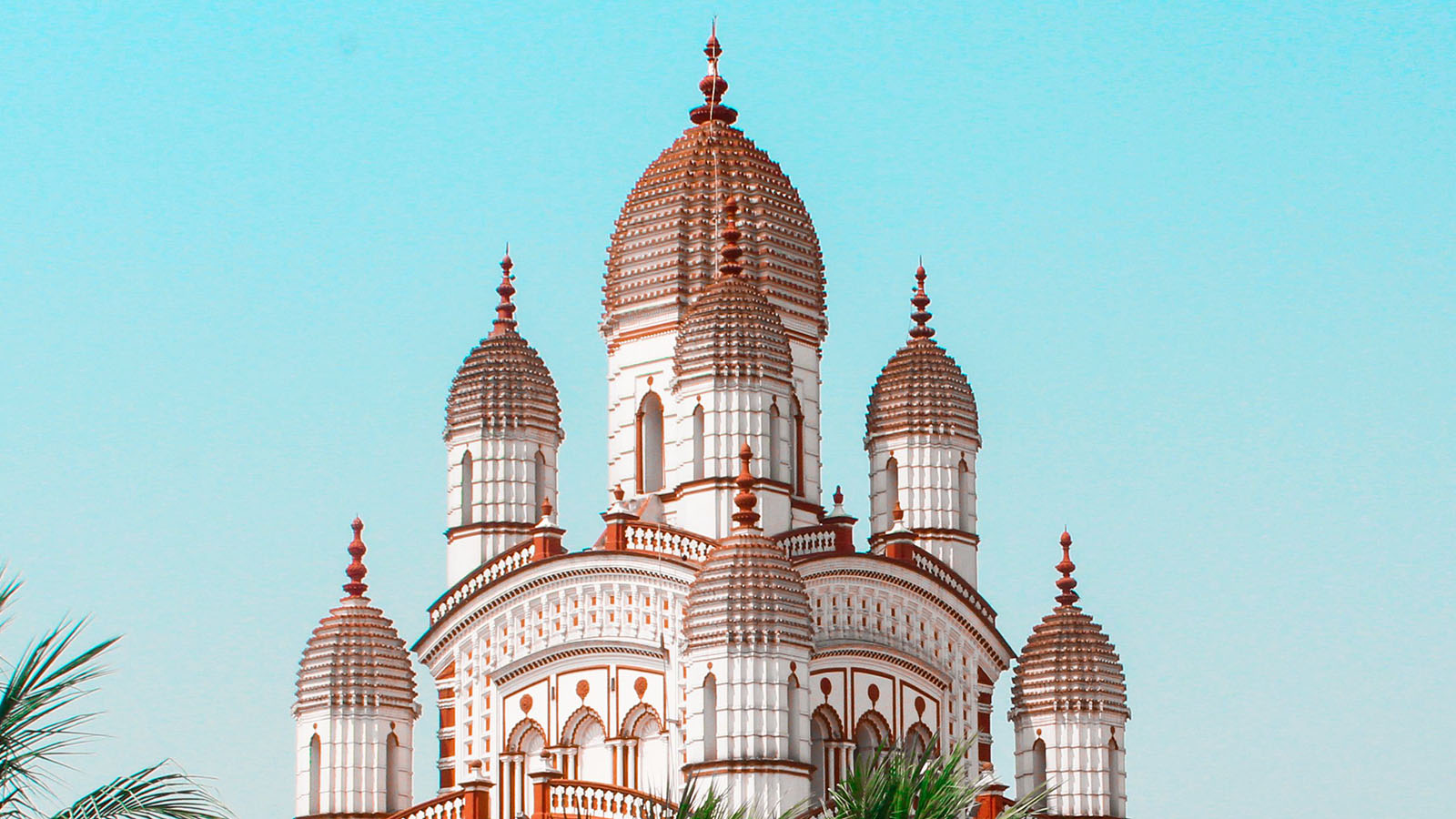 Dakshineswar Kali Temple (multiple domes with intricate brown-edged designs) in Kolkata, India