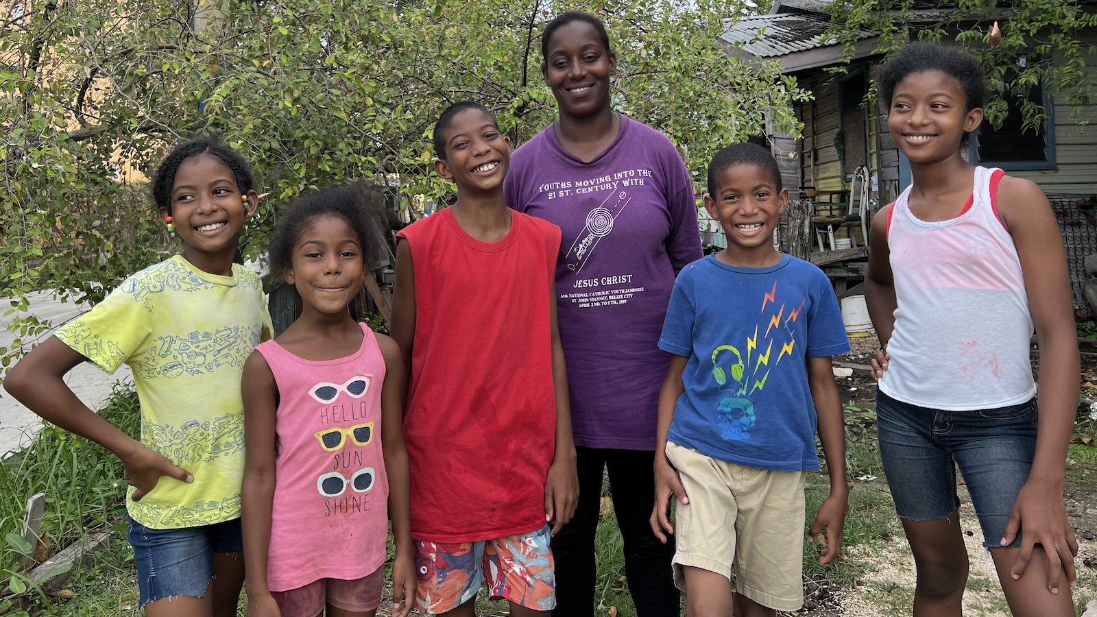 Family smiling together outside