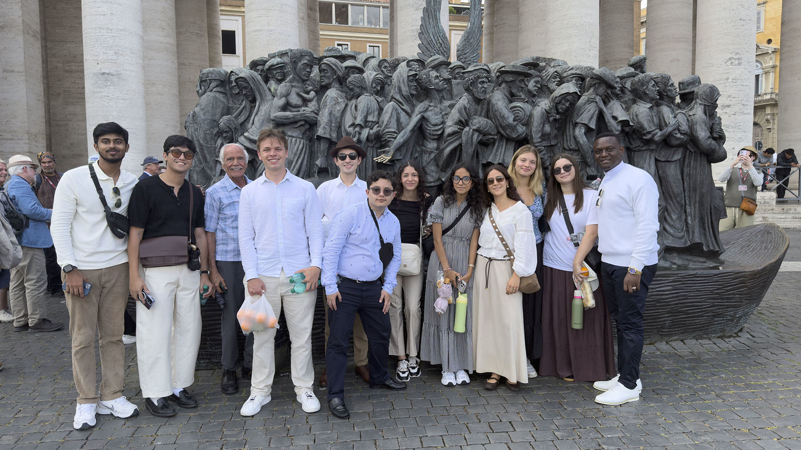 Global Citizenship Fellows in front of a statue in St. Peter's Square in Rome