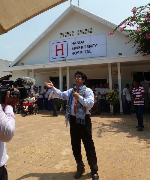 Haruhisa Handa in front of the Handa Emergency Hospital 