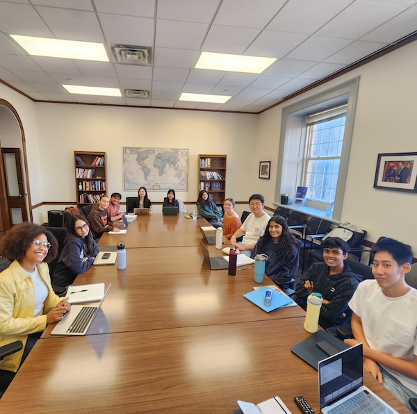 Katherine Marshall's 2026 freshman seminar class sits around a conference table