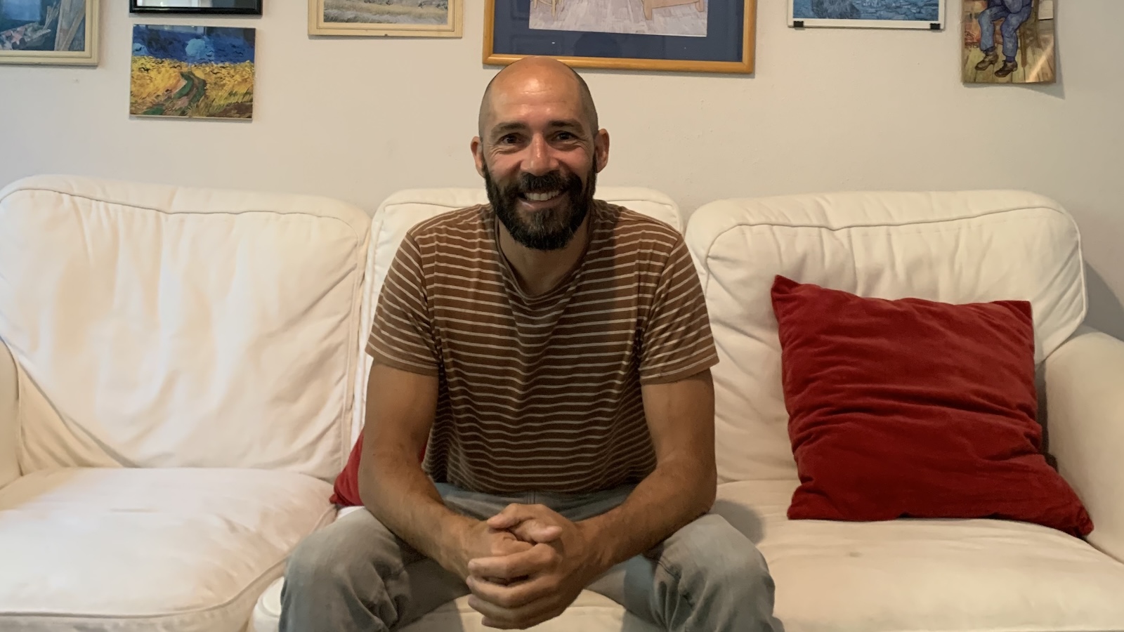 Hugo Marques sitting on a couch