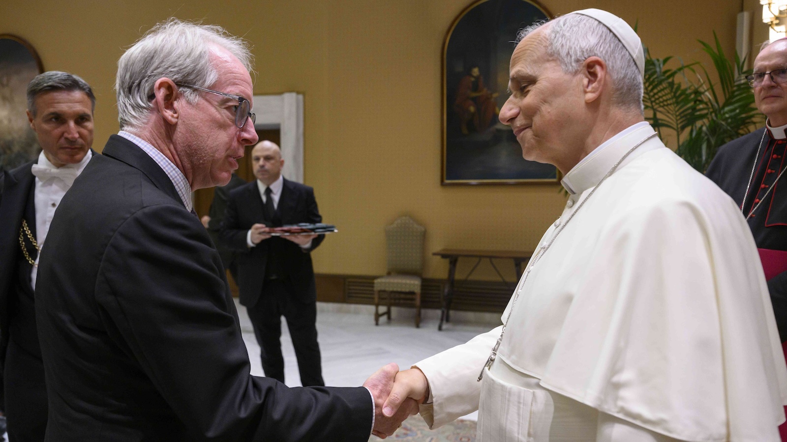 Paul Elie shakes hands with Pope Leo XIV