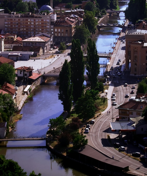 City buildings in Sarajevo along a river