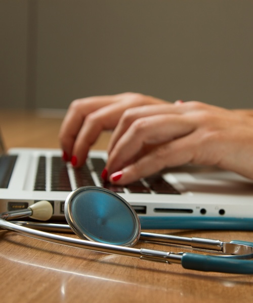 Stethoscope with a computer and hands