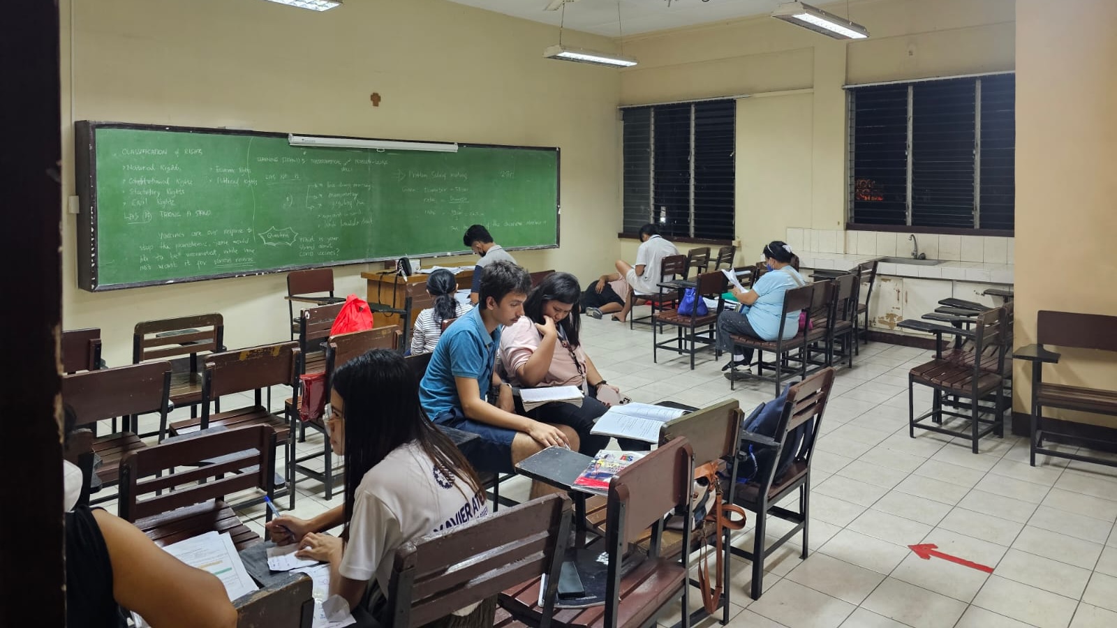 Students and a tutor in a classroom in the Philippines