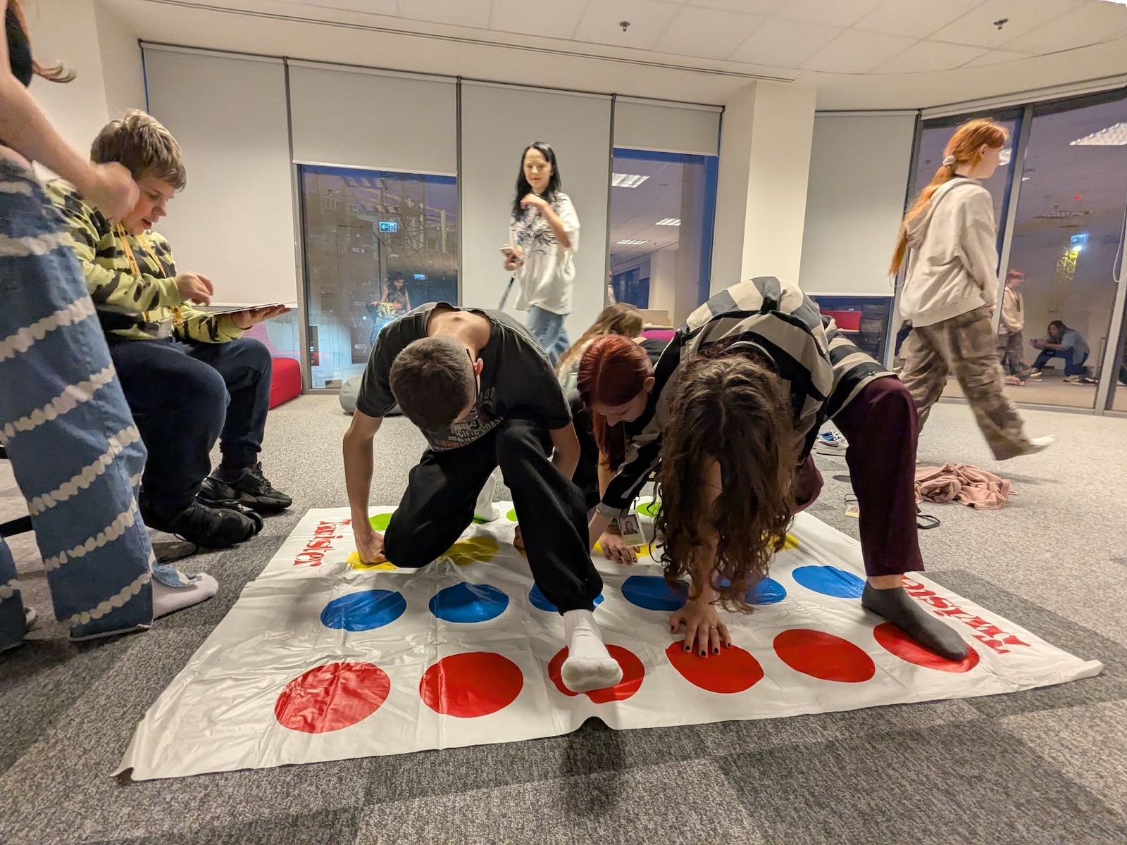 Students playing a game of Twister