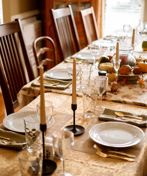 A table set with decorations for Thanksgiving