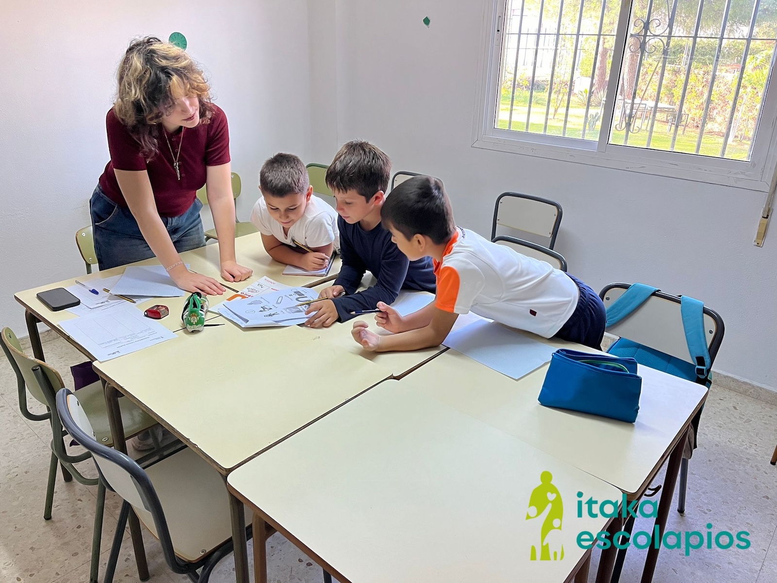 A volunteer helping children