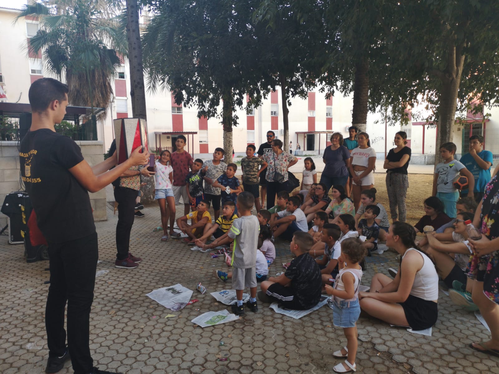 Volunteer presenting to a group of people outside