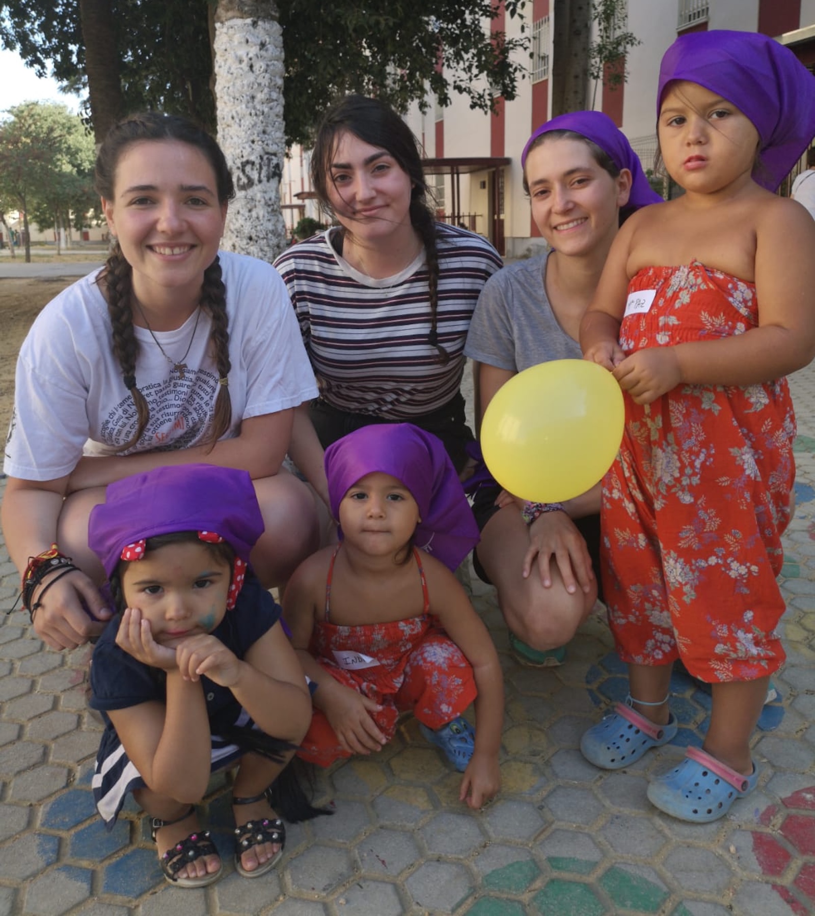 Volunteers helping children