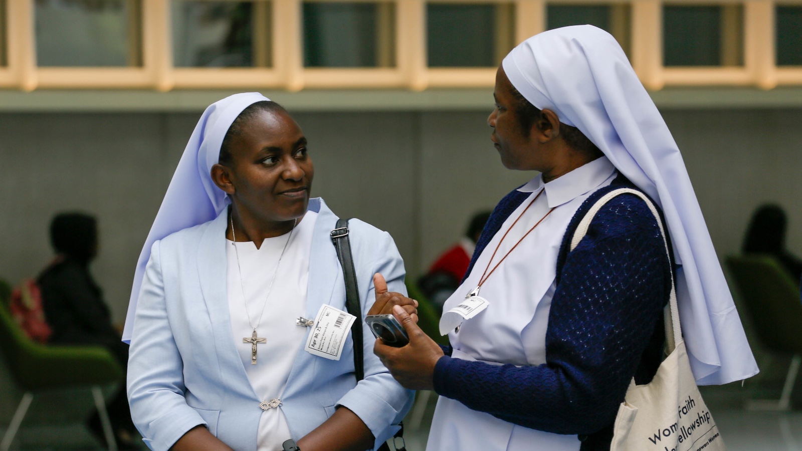 Two Catholic sisters speaking together