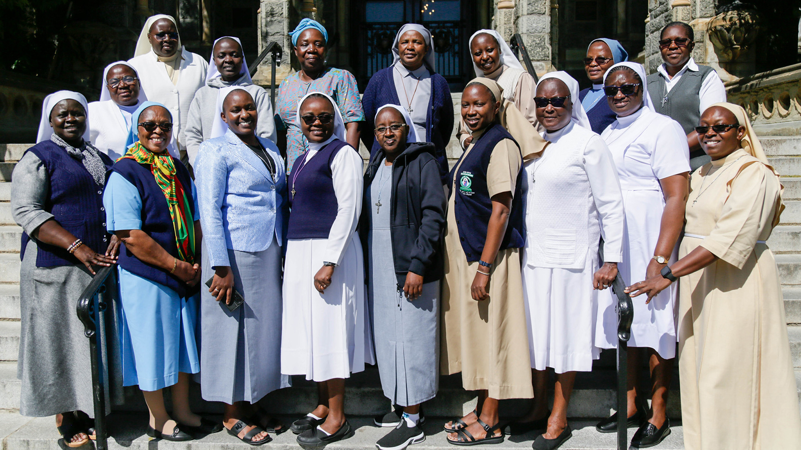 Women Faith Leaders Fellowship 2024-2025 cohort on the steps of Healy Hall