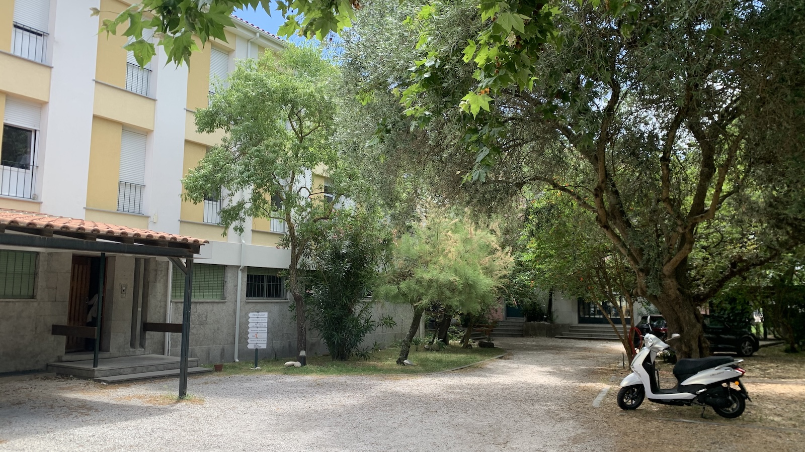 Yellow Building with a scooter in front