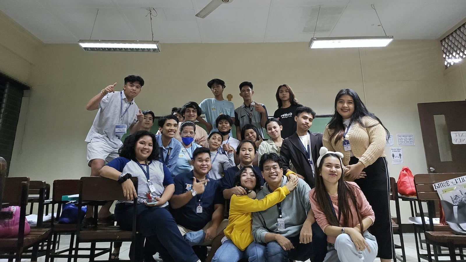 Young people gathered for a photo in a classroom