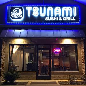 Tsunami Sushi and Grill logo