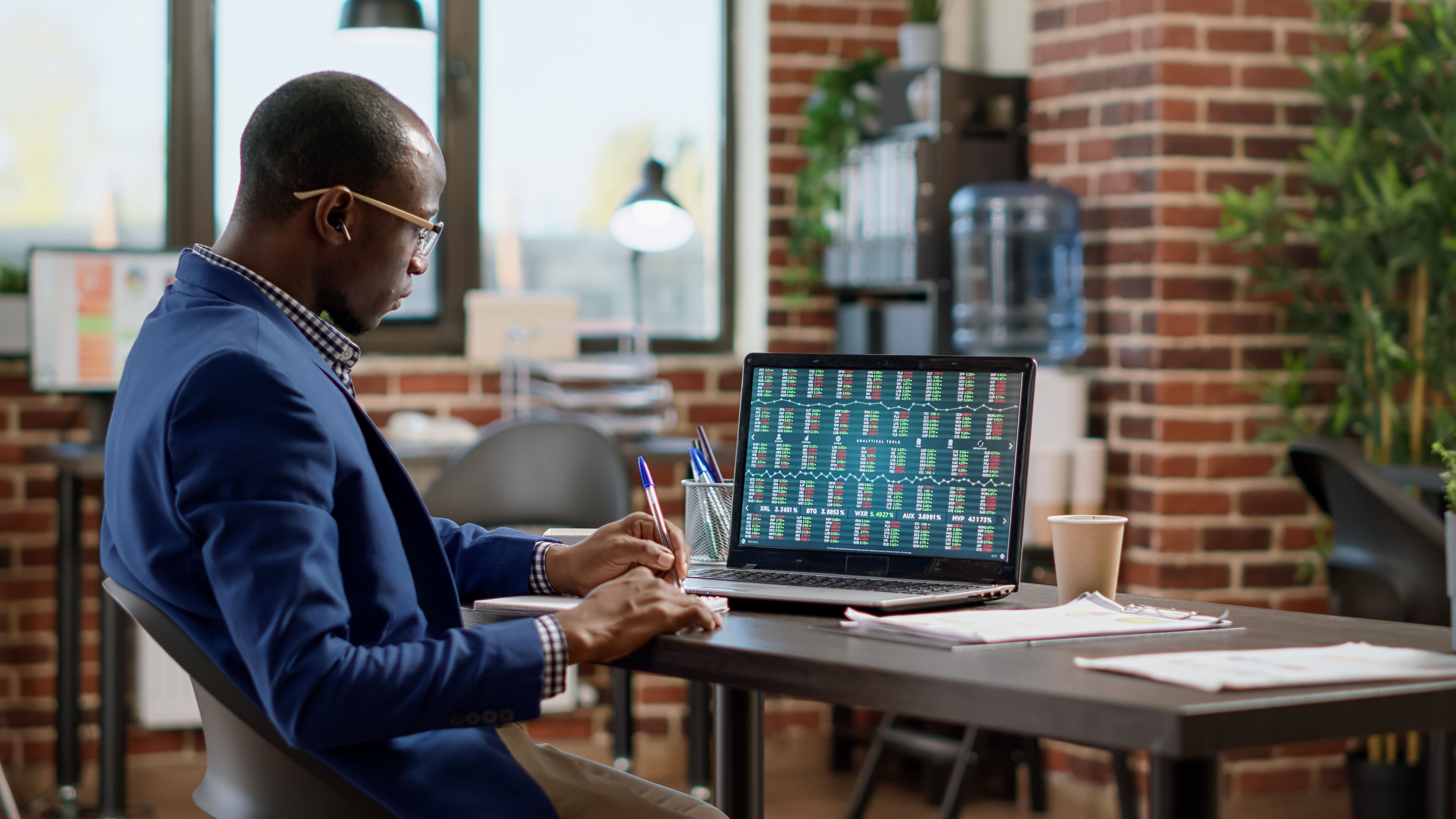 banking-specialist-analyzing-stock-market-statisti-2022-07-12-15-00-35-utc (1).jpg