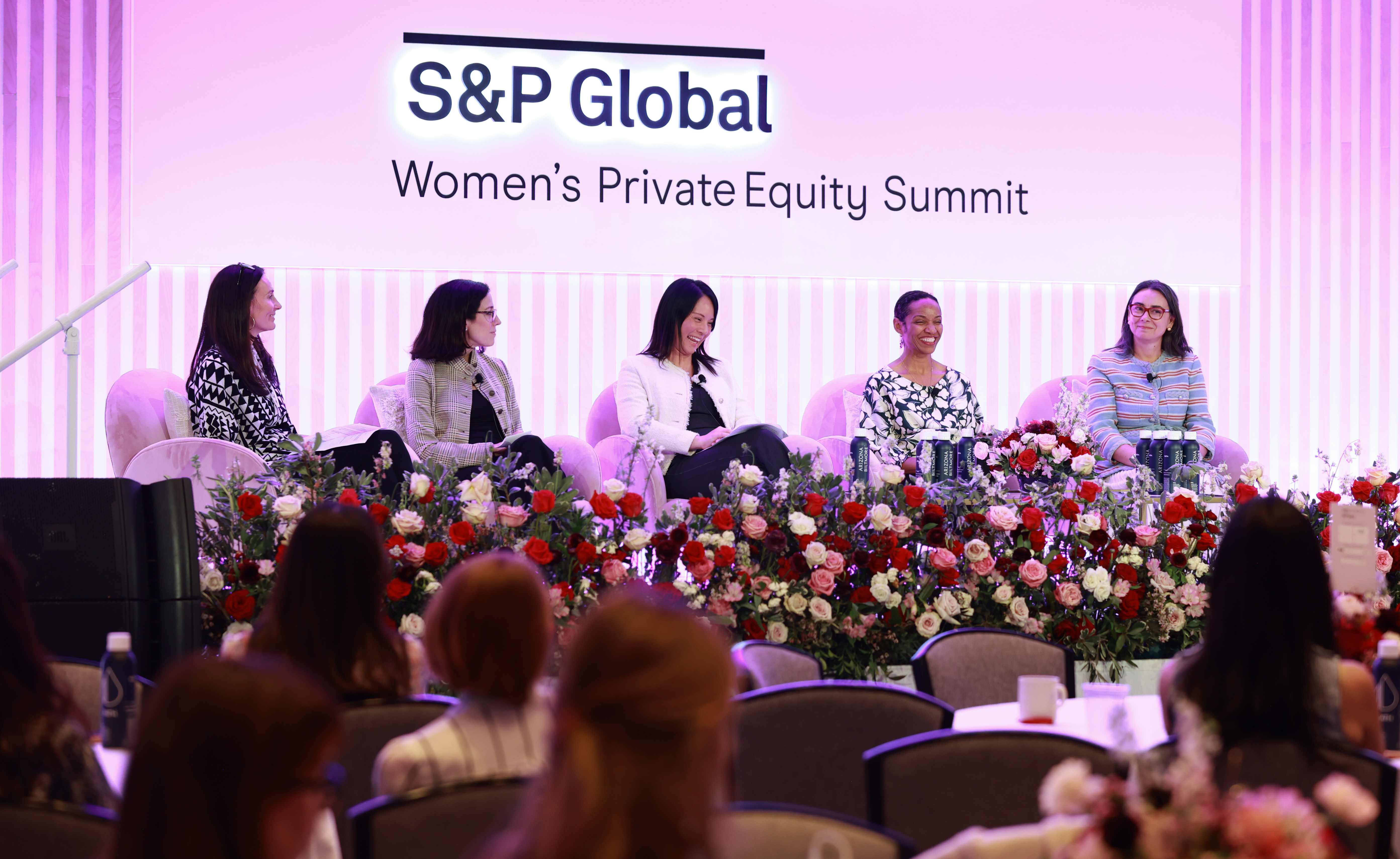 Speaker presenting on stage at Women's Private Equity Summit Arizona 2026