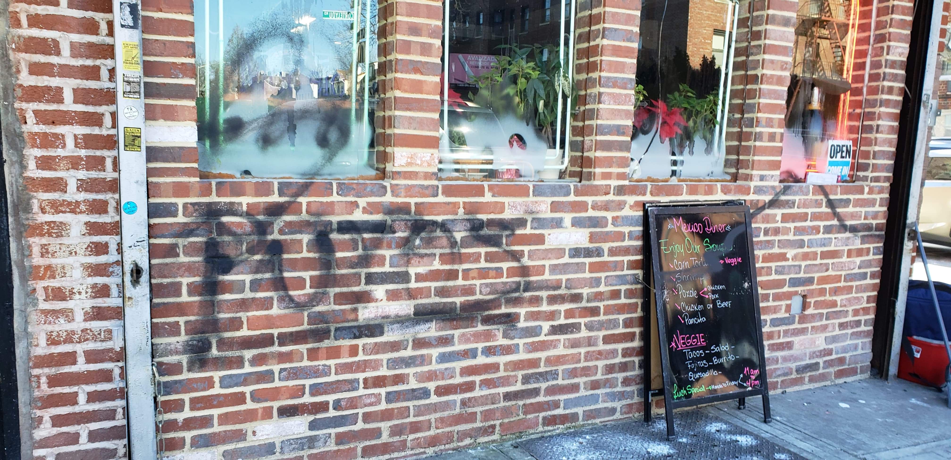 Unidentified person graffitied the words "Putos" outside Mexican Diner in Ditmas Park (Photo credit: Je Suis Encrateia)