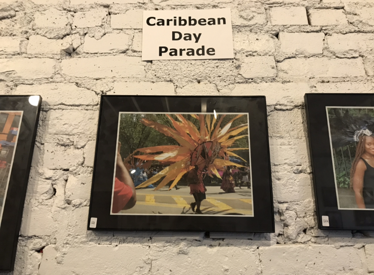 Snapshots of the West Indian Labor Day Parade at the photo exhibit on living in Crown Heights. The gallery is curated by the Nostrand Avenue Improvement Association (Photo: Kadia Goba/Bklyner)