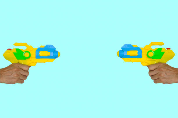 Two Hands Holding Water Powered Nerf Guns, Ready to Fight on Blue Background