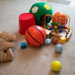 Various Basketball Toys for 5 Year Olds Scattered in the Living Room