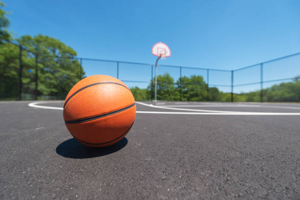 The Photo Shows Playground Balls On An Outdoor Basketball Court