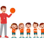 A young teacher is giving a Toddler Basketball Program lesson to the children's basketball team.