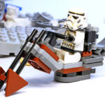 2000 Star Wars LEGO Sets: LEGO Sand Soldiers from the movie series ride a flying motorcycle against a backdrop of ruins.