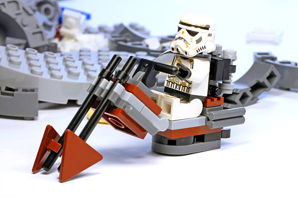 2000 Star Wars LEGO Sets: LEGO Sand Soldiers from the movie series ride a flying motorcycle against a backdrop of ruins.