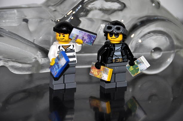2012 Lego Ninjago Sets: Two robbers stand in front of a glass car, holding Swiss franc banknotes of different denominations.