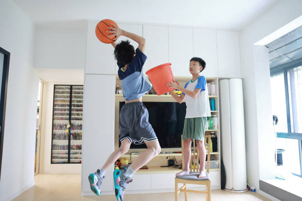 The Two Boys Used Basketball Gifts For 10 Year Old Boy To Simulate A Family Basketball Game