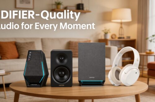 Promotional image with text overlay reading "EDIFIER-Quality Audio for Every Moment". It showcases the gaming satellite speaker, studio desktop speaker, subwoofer, and wireless ANC headphones lined up on a living room coffee table.