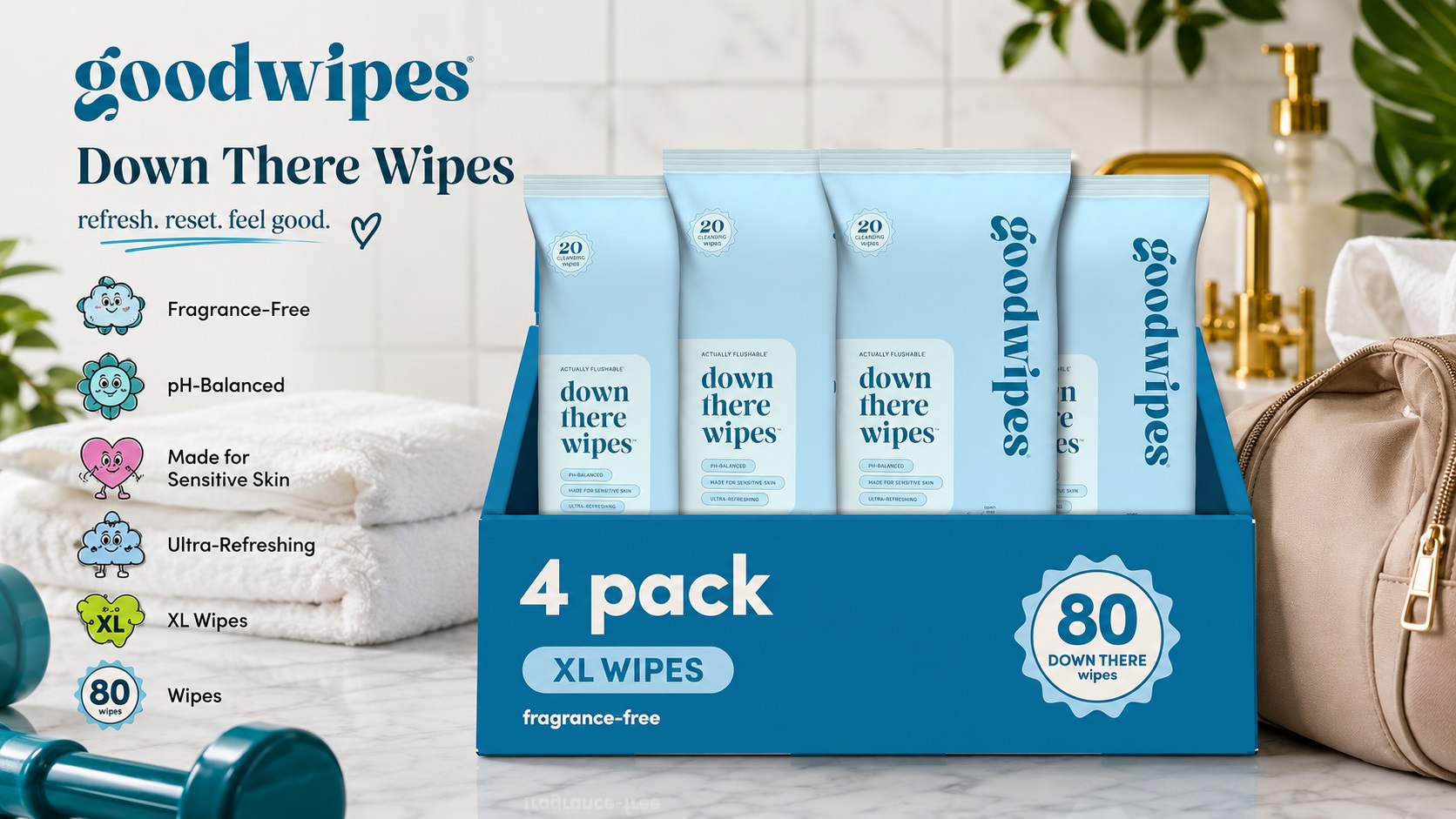 Goodwipes "Down There Wipes" fragrance-free flushable wipes 4-pack box (80 XL wipes total) on a marble surface. Styled next to a duffel bag and a teal dumbbell for an active lifestyle theme.