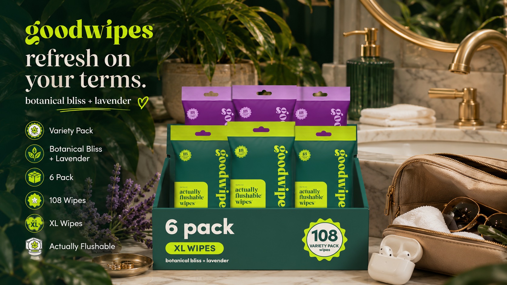 Goodwipes Botanical Bliss and Lavender flushable wipes 6-pack display box with 108 XL wipes. Arranged on a marble bathroom counter with lavender flowers, plants, and an earbud case.