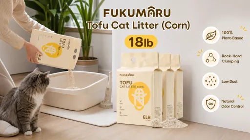 A person pouring 18lb FUKUMARU plant-based, low-dust corn blend tofu cat litter into a litter box as a cat watches nearby.