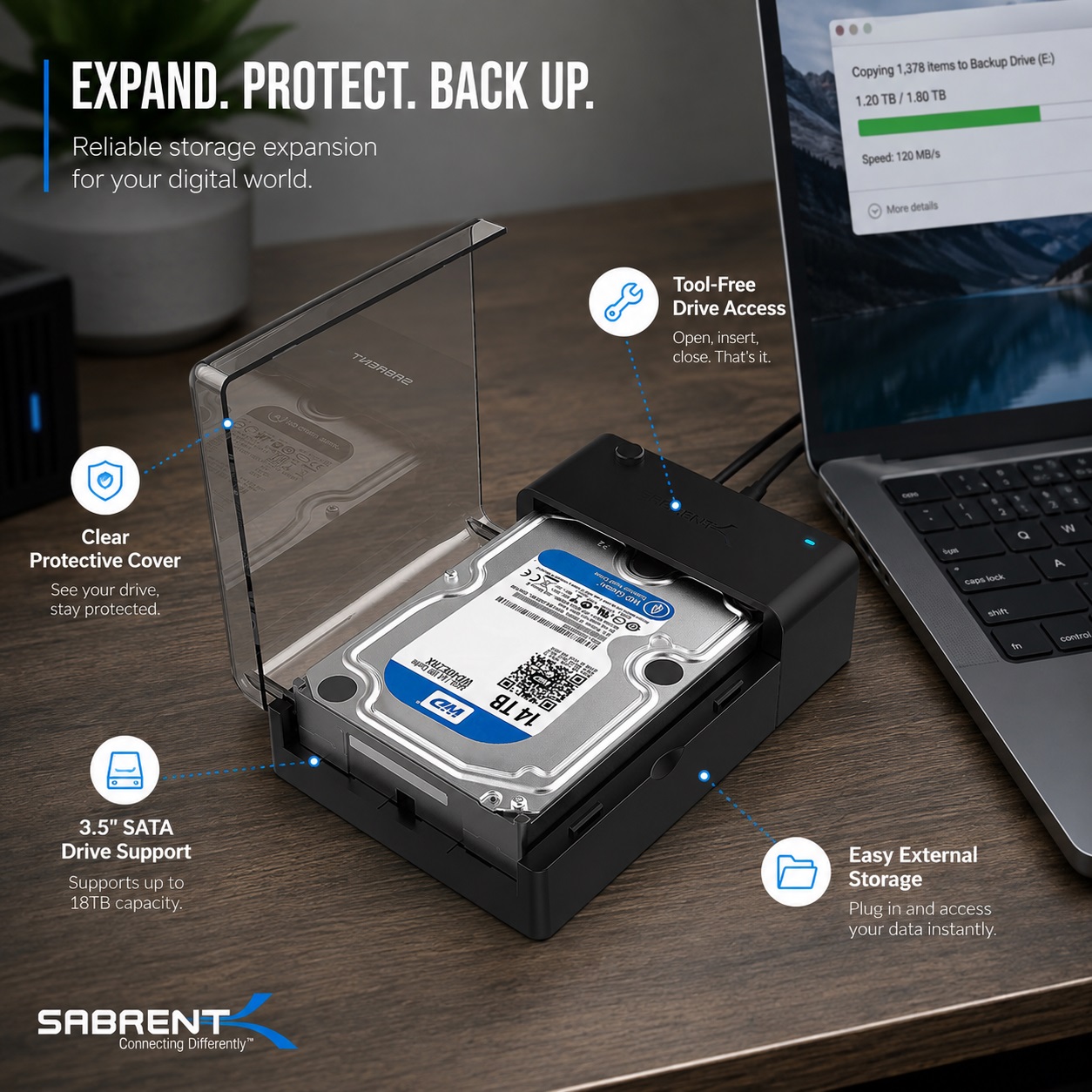 SABRENT external hard drive enclosure with transparent protective cover installed on a desktop setup, showing tool-free drive access, 3.5-inch SATA drive support, and easy external storage expansion beside a laptop.